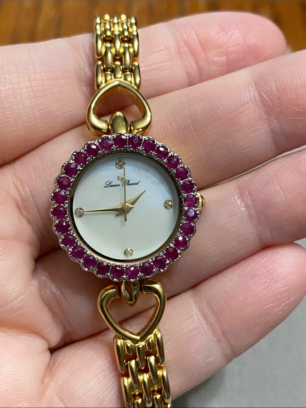 Lucien Piccard Gold-Tone Watch with Ruby Stone Bezel